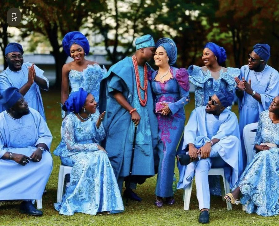 Family in coordinated blue aso-ebi